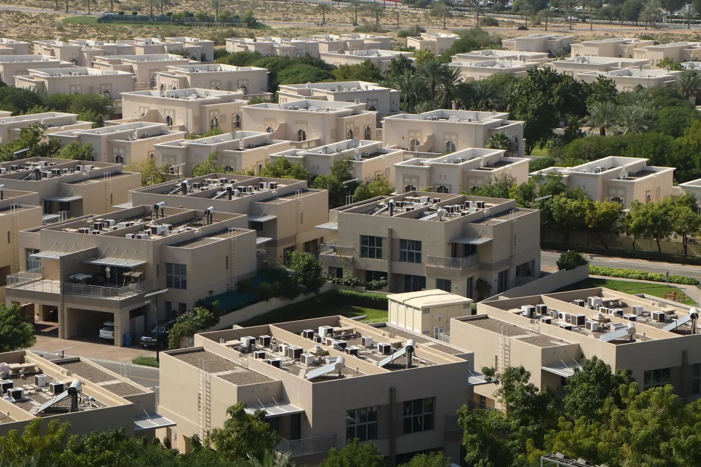 Townhouse clusters on a landscaped street